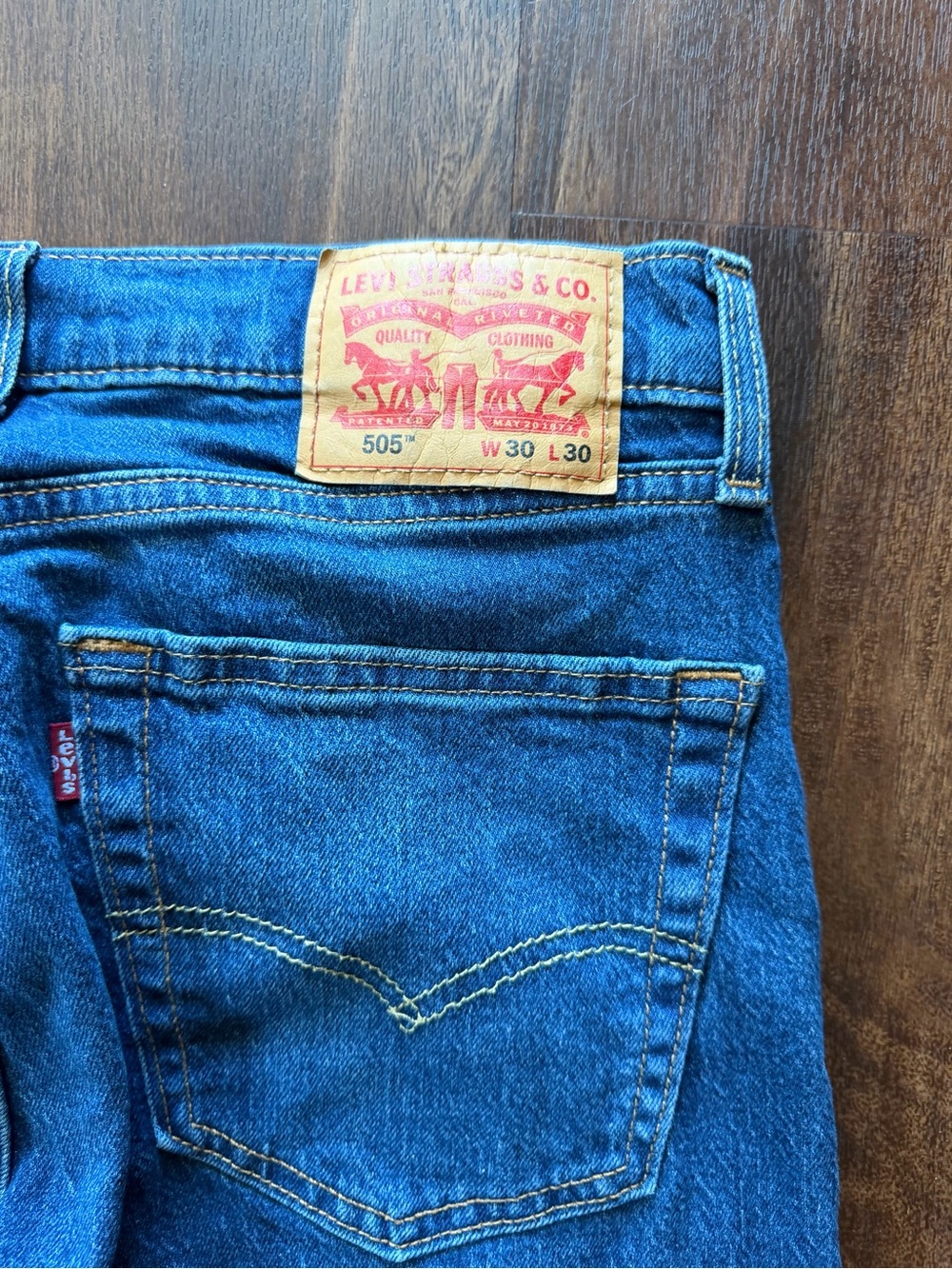 Levi's Men's Straight Jeans in Deep Blue Denim with Tan Patch